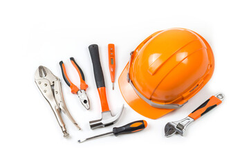 Fototapeta premium Helmet Safety Hand tools, Work Gloves and Hammer, isolated on white background, Yellow safety helmet for construction and tools on white background.