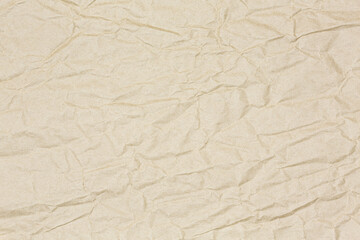 crumpled light brown recycled wrap paper textured background