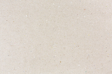 grey recycled craft paper with showing multicolored paper fibers. high detailed texture.