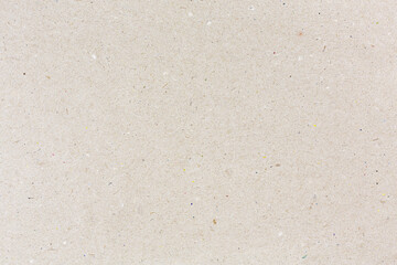 grey recycled craft paper with showing multicolored paper fibers. high detailed texture.