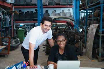 Fototapeta na wymiar Woman work with man, smile and happy together. Diversity of two people, black African worker woman and caucasian business manager smile and happy together in factory-warehouse