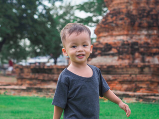 Asian boy Smile with happiness in the open space.