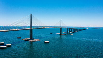 Sunshine Skyway Bridge in Tampa Bay Florida. Large Suspension Bridge that ships pass underneath. Florida gulf coast fishing pier.