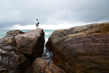 Obraz premium Seaside rocks on Khao Na Yak beach, a beautiful tourist attraction in Ban Tha Din Daeng community