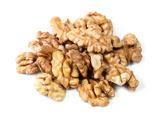 handful of shelled walnuts closeup on white