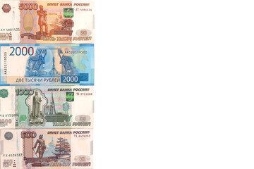 500, 1000, 2000, 5000 russian ruble bills on the left side isolated