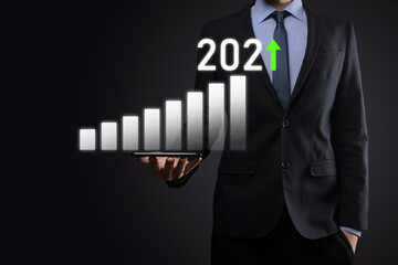Business development to success and growing growth year 2021 concept.Plan business growth graph in year 2021 concept.Businessman plan and increase of positive indicators in his business