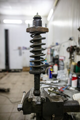 Repair of a shock absorber on a car.