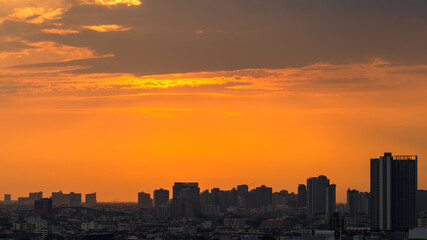 The high angle background of the city view with the secret light of the evening, blurring of night lights, showing the distribution of condominiums, dense homes in the capital community