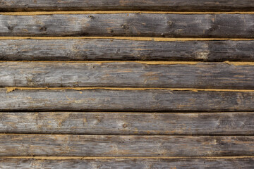 wall texture of wooden logs with caulked cracks