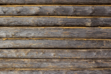 wall texture of wooden logs with caulked cracks