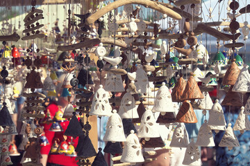 Clay bells. Selective focus. Arts and crafts fair.