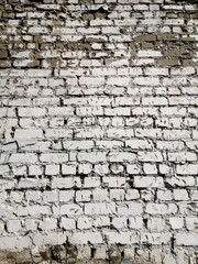 Old crumbling brick wall as an abstract