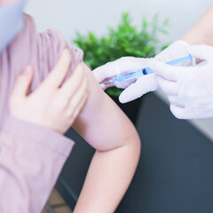 corona virus vaccine injection to child