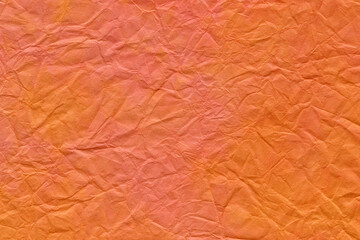 和紙テクスチャー背景(オレンジ色)  皺が入った橙色の揉染め和紙