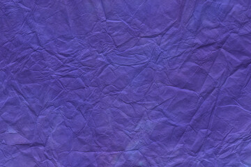 Fototapeta na wymiar 和紙テクスチャー背景(紫色) 揉み染めした鮮やかな青紫色の和紙