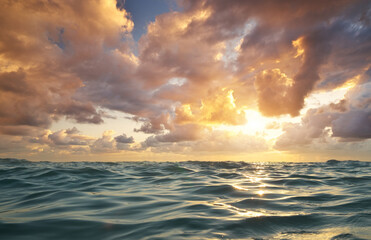 Sea waves on sunset.