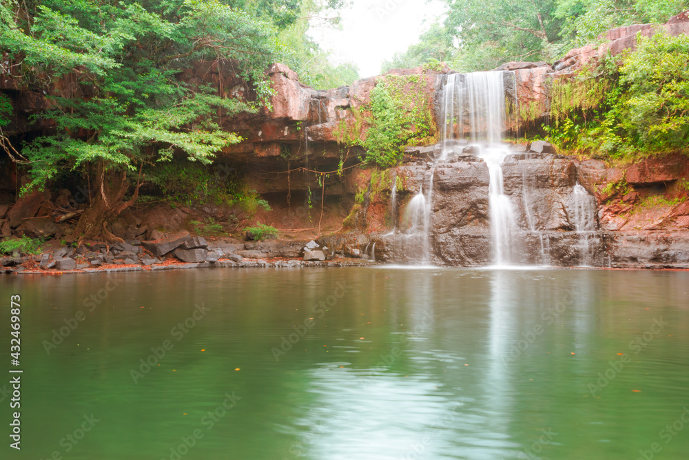 Wall mural the view of the waterfall at koh kood during the day when it looks so wet.