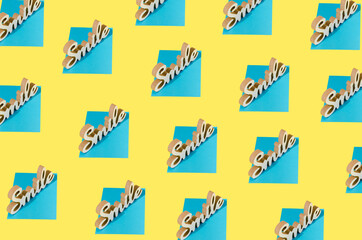 Creative layout made of smile sign on a blue base. Minimal positive concept idea.