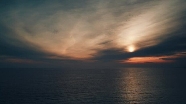 Seascape. Sunset over sea surface. Night is falling. Nature landscape. Time lapse