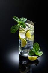 Mojito cocktail with ice, lime, and mint.
