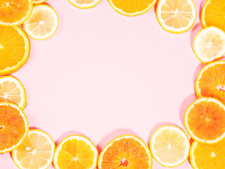 Colorful orange citrus slice fruit texture background on pastel pink