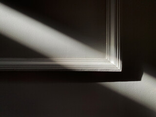Diagonal light on empty frame in grey colour. Abstract. Minimalistic for design. 