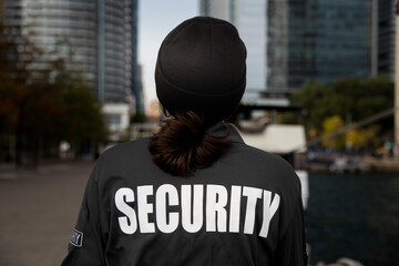 Security guard in uniform patrolling residential area