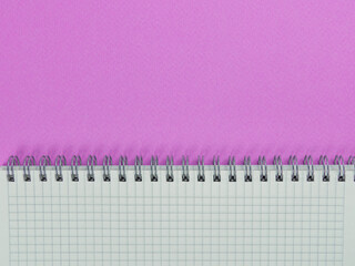 Workplace. Office conception on a pink background. Notepad. Flat lay.