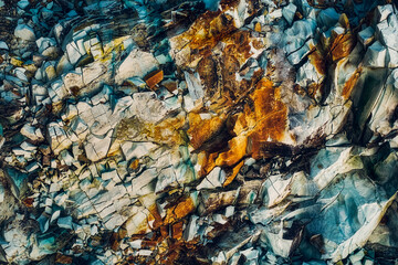 blue and rusty natural rock texture, close view