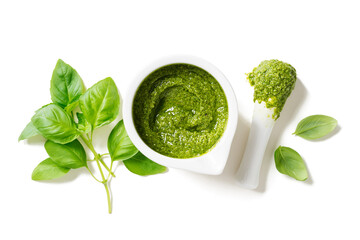 Fresh Italian pesto sauce with basil, pine nuts, parmesan cheese and olive oil isolated on white  background. Top view 