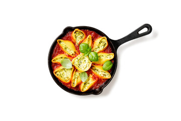 Stuffed pasta shells with spinach and ricotta served with parmesan cheese and fresh basil leaves.Healthy vegetarian food recipe. Isolated on white background. Top view