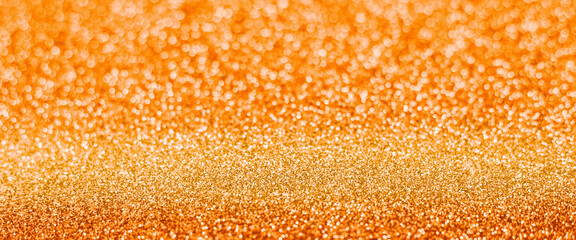 orange glitter glitter, close-up. Can be used as a background. Banner