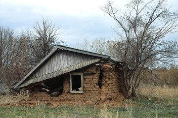 Abandoned damaged house in countryside