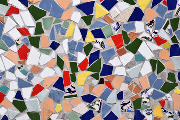 Close Up of Colourful Ceramic Pieces Making up Decorative Mosaic on Wall