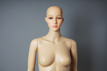 store window mannequin or display dummy with bald head and bare bust - obrazy, fototapety, plakaty