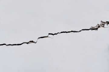 Cleaned white wall with large cracked pattern as background