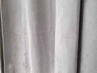 Gray polyester curtains, blackout curtains made from recycled material. Close-up