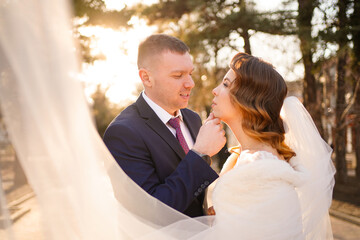 portrait of loving and happy newlywed. wedding fashion. dress with long veil
