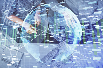 Double exposure of man and woman working together and business theme hologram drawing. Computer background. Top View.