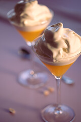 Dessert made of jelly and vanilla ice-cream in martini glasses