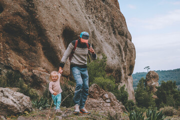 Family hiking father and daughter child outdoor together in mountains travel adventure healthy...