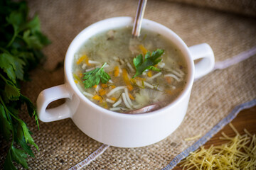 cooked hot soup with noodles and vegetables