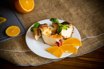 Sweet curd casserole with fruits in a plate
