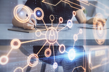 Double exposure of woman hands typing on computer and social network theme hologram drawing. People media concept.