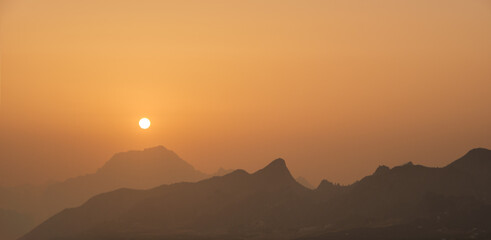 Landscape reminiscent of a landscape of Mars with reddish and very orange tones