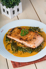 baked salmon in tomato cream spinach sauce