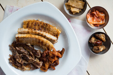 a set of grilled pork belly and marinated thinly sliced beef