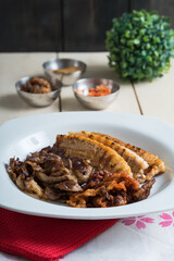 a set of grilled pork belly and marinated thinly sliced beef