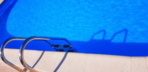 swimming pool with water and ladder